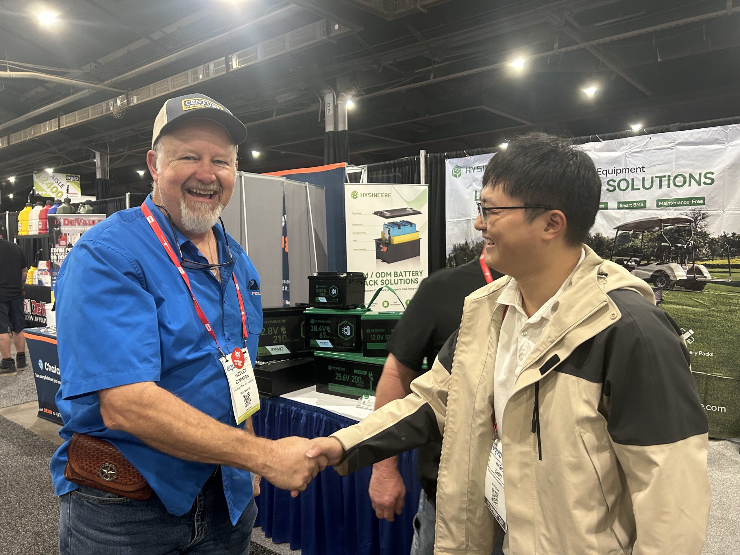 A Hysincere team member shaking hands with a visitor at Equip Expo 2026